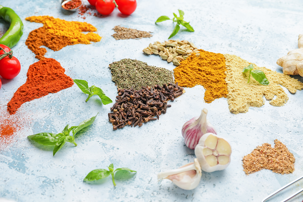 assortment of colorful spices and fresh herbs.