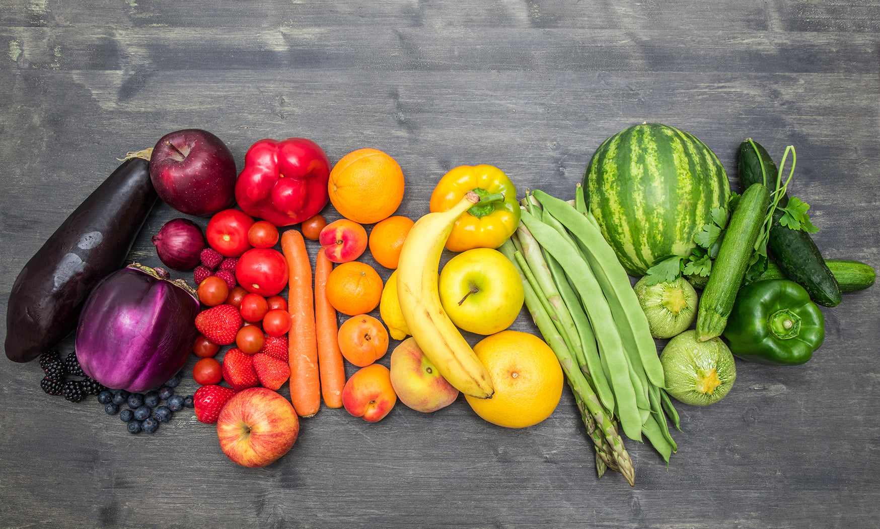 Assortment of fresh vegetables arranged in a rainbow of colors. 