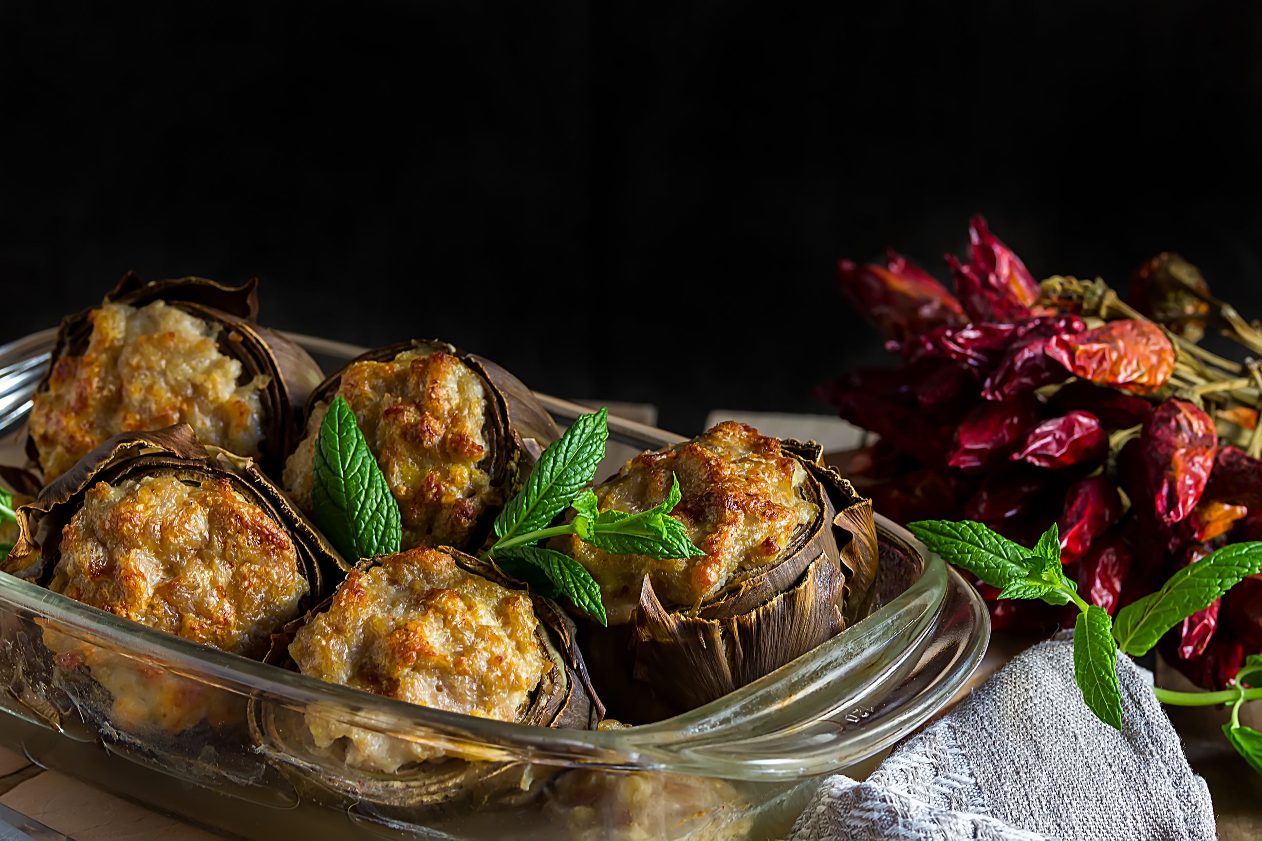 Grilled artichokes filled with a mixture of breadcrumbs, garlic, herbs, and cheese.