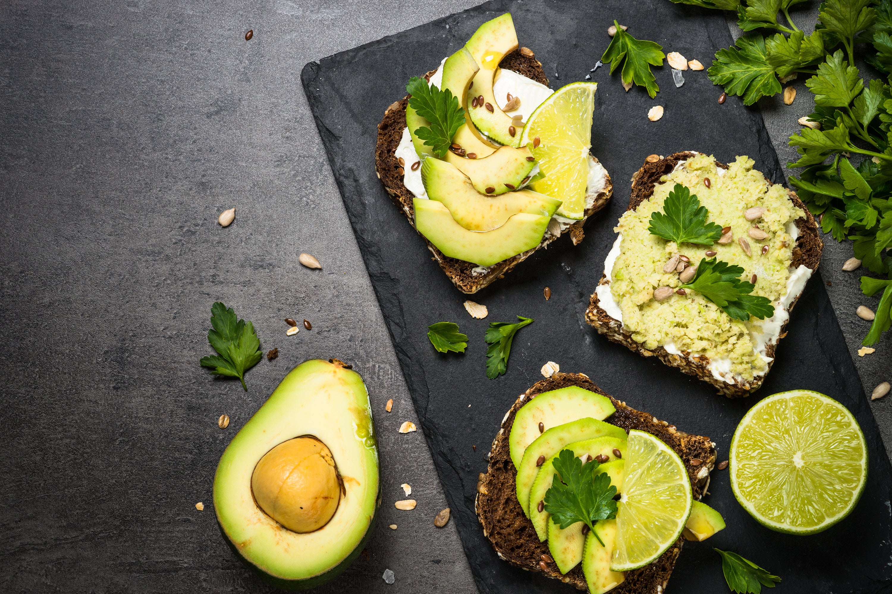 Avocado Toast is toasted bread is topped with mashed avocado and drizzled with avocado oil, then seasoned with salt and pepper.