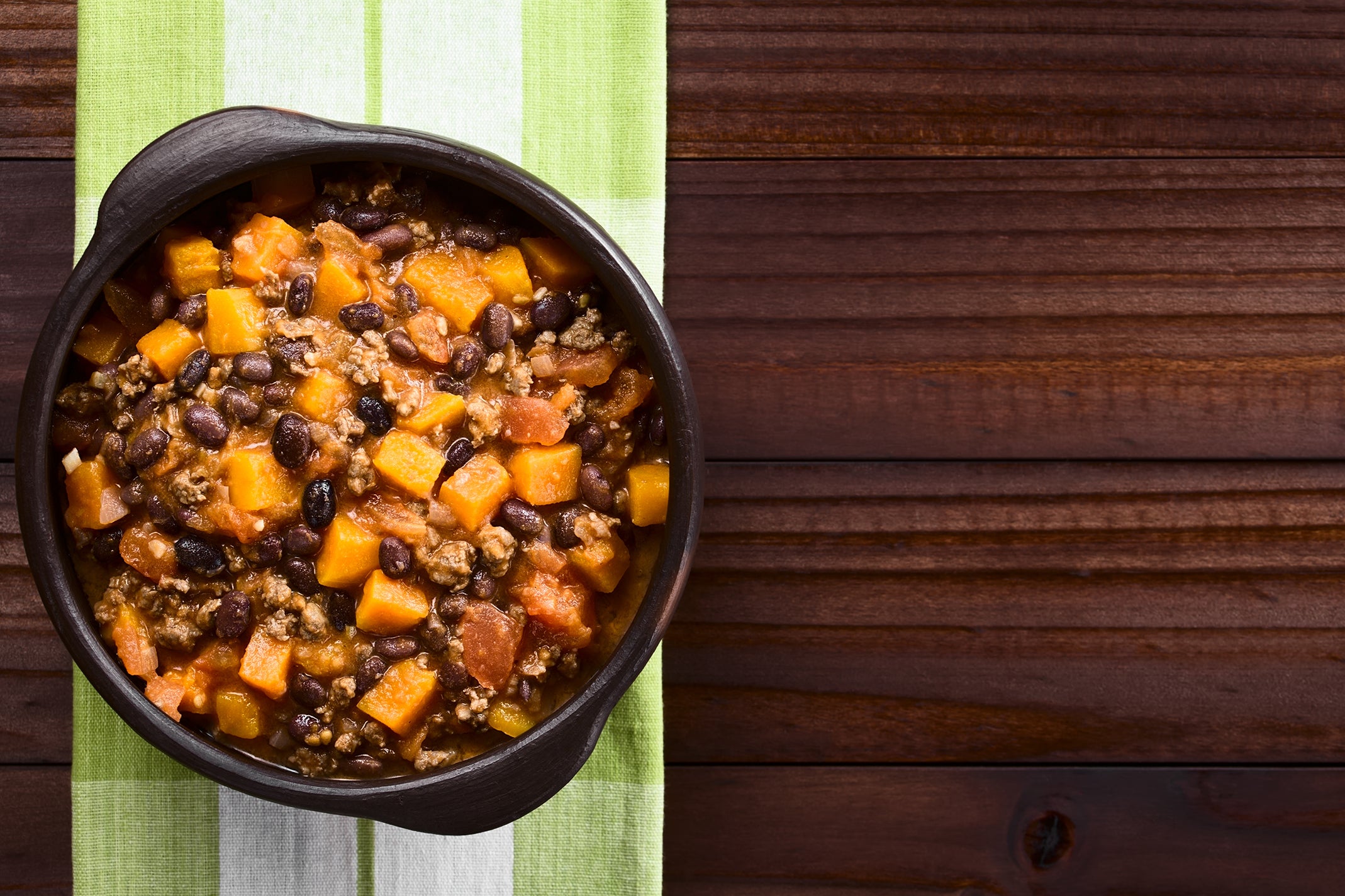 Vegetarian Chili is made with black beans, vegetables, and spices, such as cumin, chili powder, and paprika.