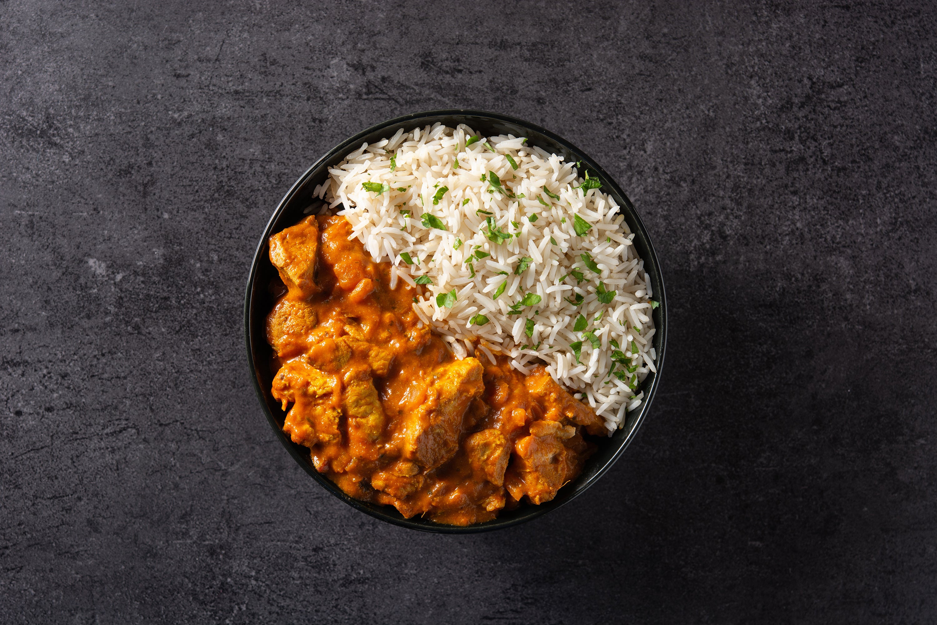 Indian Butter Chicken is a creamy and flavorful dish made with chicken, tomatoes, cream, and a blend of spices such as cardamom, coriander, and cumin. 
