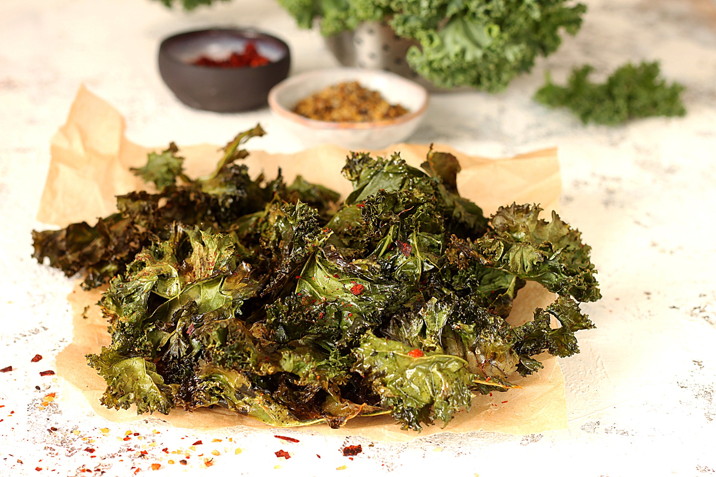 Kale chips are a healthy and crispy snack made by roasting kale leaves with olive oil and seasonings.