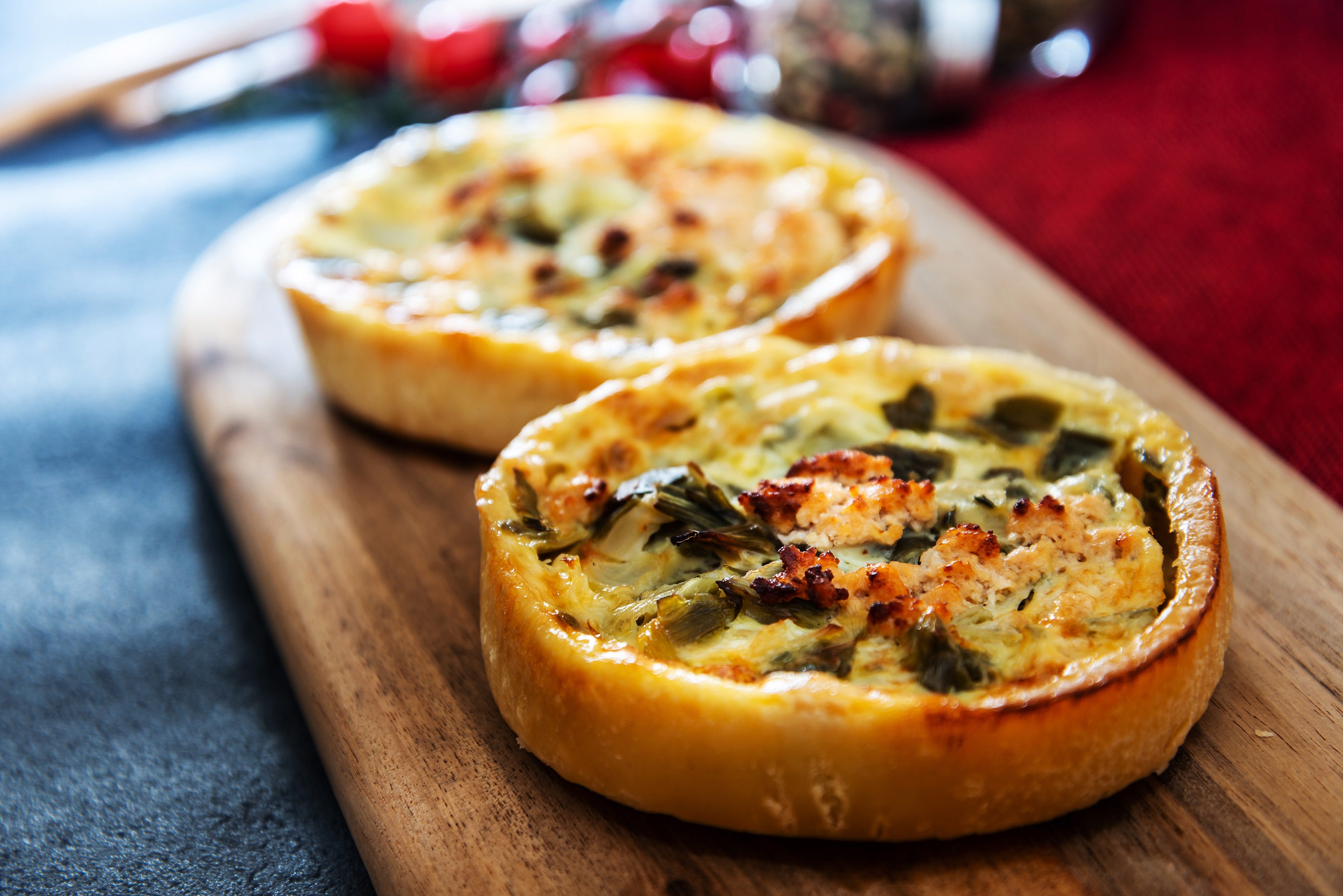 Quiche is a savory pie made with a pastry crust, eggs, cheese, and various fillings such as leeks, mushrooms, and bacon. 