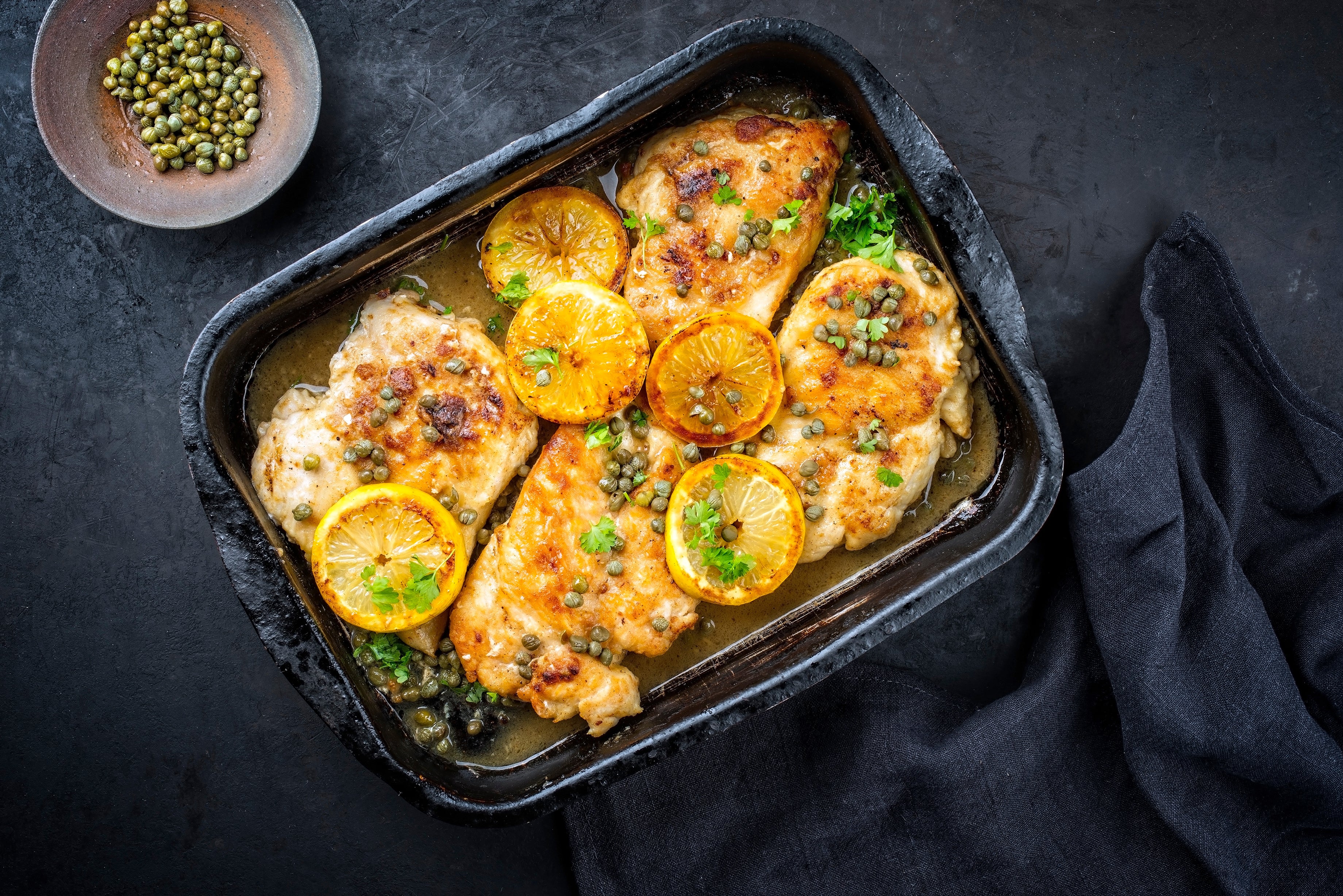 Chicken dish made with lemon juice, garlic, and herbs such as rosemary and thyme.