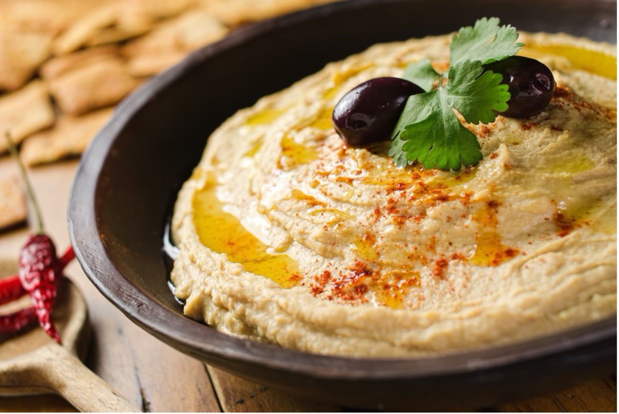 Middle Eastern Hummus is a creamy and flavorful dip made with chickpeas, tahini, and a blend of spices such as cumin, garlic, and lemon juice.